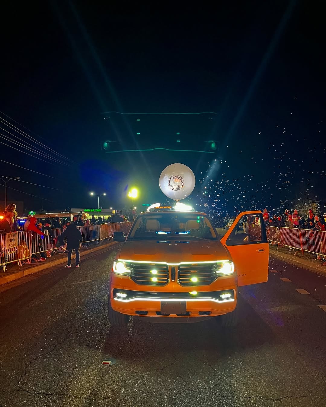Parade vehicle with glowing custom Airstar sphere and confetti cannon blast